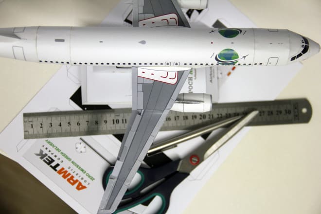 I will design a custom made paper model with your logo on it